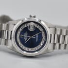 ROLEX DAY-DATE BLUE MYRIAD DIAL PLATINUM REF. 18206 BOX AND PAPERS